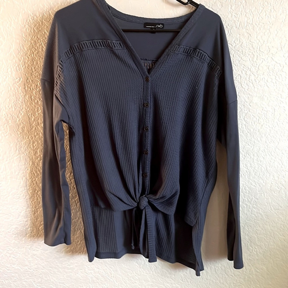 Woman high front low back blouse with front tie